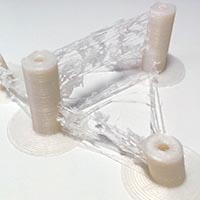CordageDes cordes de plastiques indésirables apparaissent lors de l'impression.